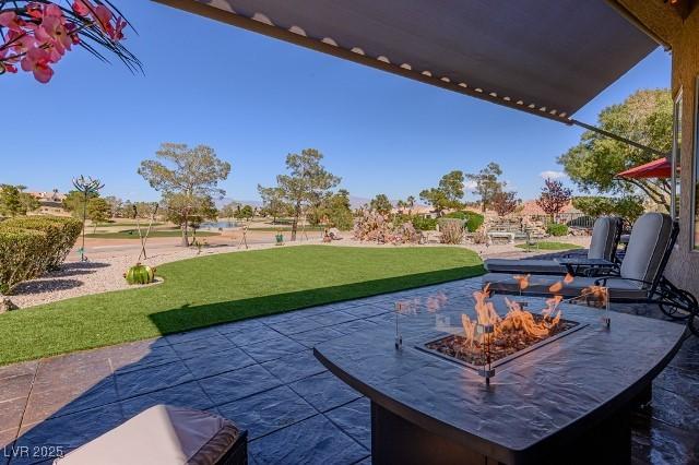 10524 Longwood Dr, Las Vegas, NV 89134 - view of patio / terrace with a fire pit