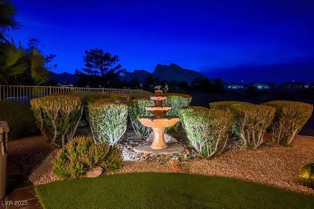 10524 Longwood Dr, Las Vegas, NV 89134 - yard at twilight featuring fence and a mountain view