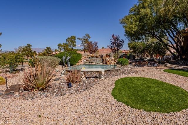10524 Longwood Dr, Las Vegas, NV 89134 - view of yard with fence and an outdoor pool