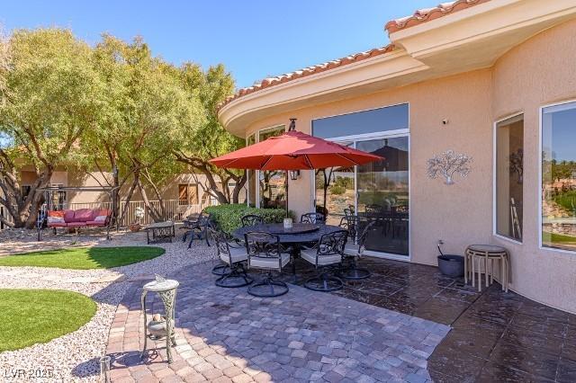10524 Longwood Dr, Las Vegas, NV 89134 - view of patio / terrace with outdoor dining space and fence