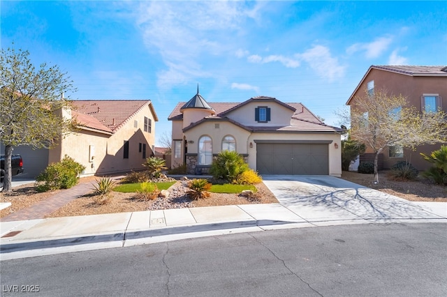 view of front facade featuring a tile roof, stucco siding, a garage, and concrete driveway