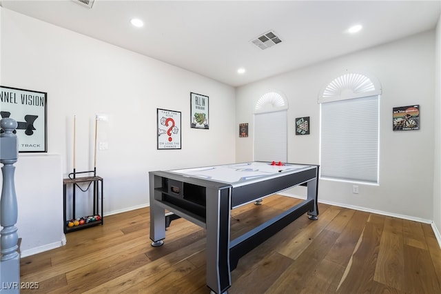 recreation room with hardwood / wood-style floors, baseboards, visible vents, and recessed lighting