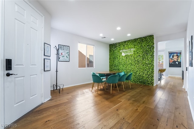 dining space featuring baseboards, visible vents, recessed lighting, and wood-type flooring
