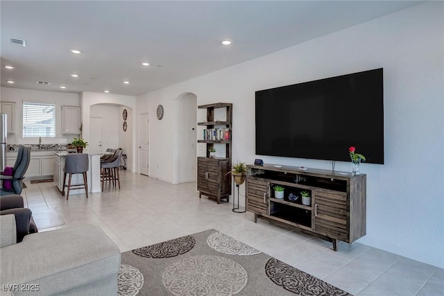 2114 Cold Canyon Ave, North Las Vegas, NV 89086 - living area with light tile patterned floors, recessed lighting, arched walkways, and visible vents