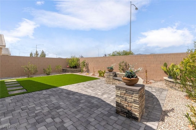 2114 Cold Canyon Ave, North Las Vegas, NV 89086 - view of patio with a fenced backyard
