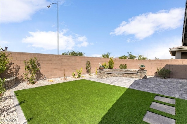 2114 Cold Canyon Ave, North Las Vegas, NV 89086 - view of yard featuring a fenced backyard and a patio