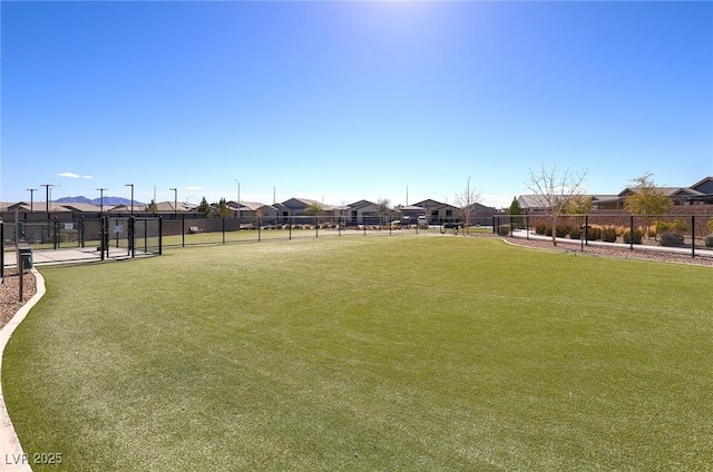 2114 Cold Canyon Ave, North Las Vegas, NV 89086 - view of community featuring a residential view, fence, and a lawn