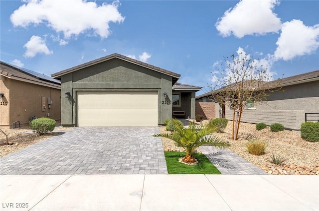 2114 Cold Canyon Ave, North Las Vegas, NV 89086 - single story home with a garage, decorative driveway, stucco siding, and fence