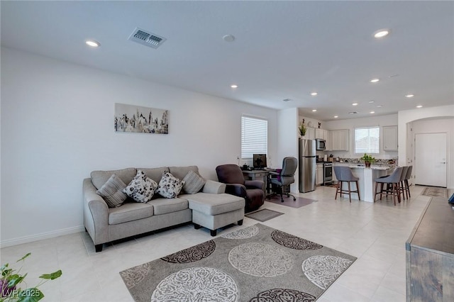 2114 Cold Canyon Ave, North Las Vegas, NV 89086 - living room with recessed lighting, arched walkways, baseboards, and visible vents