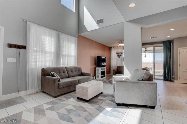 living room with light tile patterned floors, recessed lighting, baseboards, and visible vents
