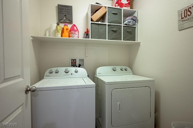 laundry area featuring independent washer and dryer and laundry area