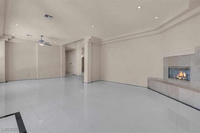 2290 Casa Bella Ct, Las Vegas, NV 89117 - unfurnished living room featuring a premium fireplace, tile patterned flooring, recessed lighting, and a ceiling fan