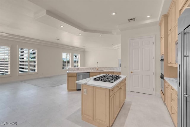 2290 Casa Bella Ct, Las Vegas, NV 89117 - kitchen featuring gas cooktop, dishwasher, open floor plan, light brown cabinets, and a kitchen island