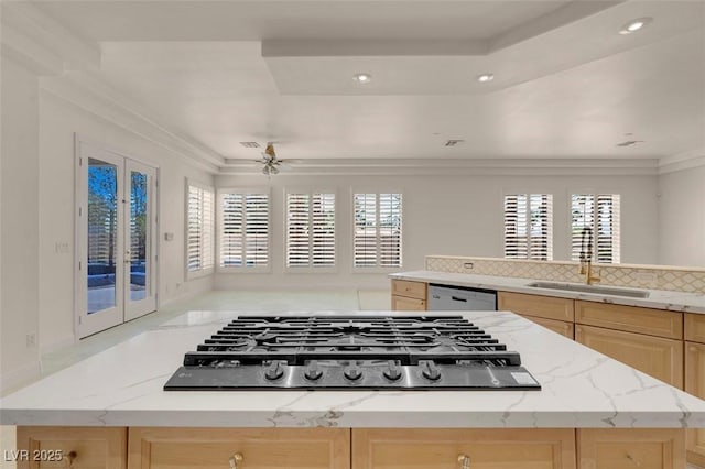 2290 Casa Bella Ct, Las Vegas, NV 89117 - kitchen with light brown cabinets, appliances with stainless steel finishes, recessed lighting, french doors, and light stone countertops