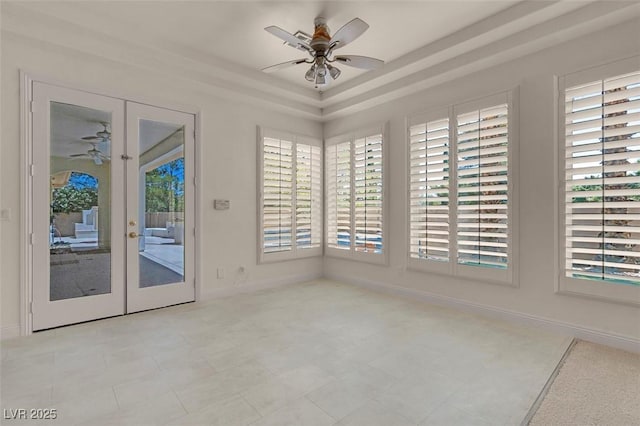2290 Casa Bella Ct, Las Vegas, NV 89117 - empty room with ceiling fan, plenty of natural light, a raised ceiling, and french doors