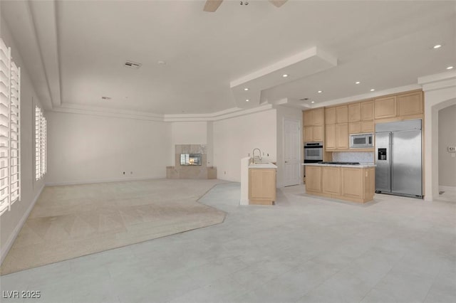 2290 Casa Bella Ct, Las Vegas, NV 89117 - unfurnished living room with recessed lighting, a glass covered fireplace, ceiling fan, arched walkways, and ornamental molding