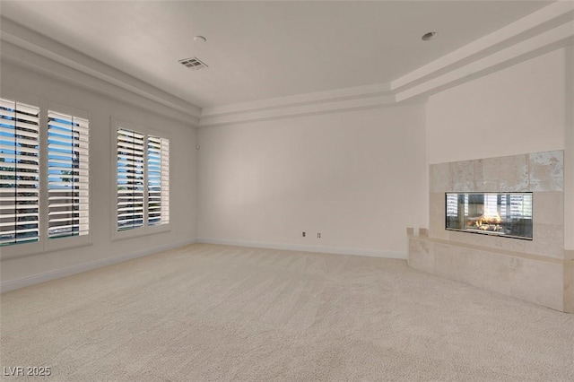 2290 Casa Bella Ct, Las Vegas, NV 89117 - unfurnished living room featuring carpet floors, a premium fireplace, and a tray ceiling