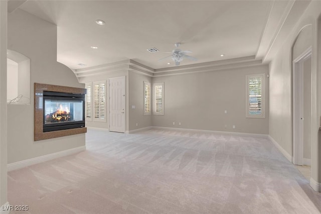 2290 Casa Bella Ct, Las Vegas, NV 89117 - unfurnished living room with light carpet, ceiling fan, a multi sided fireplace, and recessed lighting