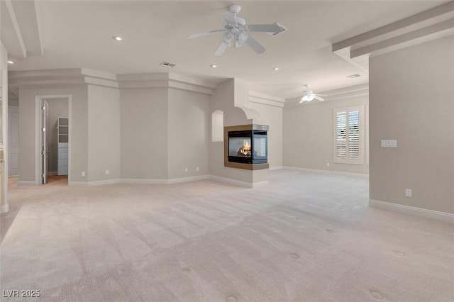2290 Casa Bella Ct, Las Vegas, NV 89117 - unfurnished living room featuring ceiling fan, light carpet, a multi sided fireplace, and recessed lighting