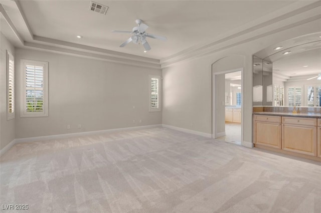 2290 Casa Bella Ct, Las Vegas, NV 89117 - spare room featuring a ceiling fan, light carpet, a raised ceiling, and recessed lighting