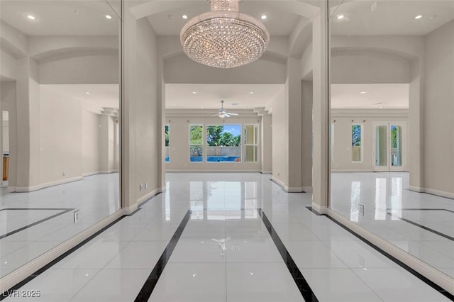 2290 Casa Bella Ct, Las Vegas, NV 89117 - corridor featuring inlaid floor details, a chandelier, recessed lighting, and a high ceiling