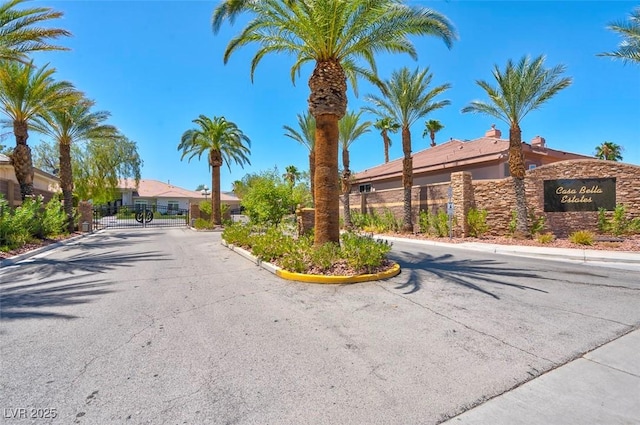 2290 Casa Bella Ct, Las Vegas, NV 89117 - view of asphalt road featuring curbs, a gated entry, and a gate