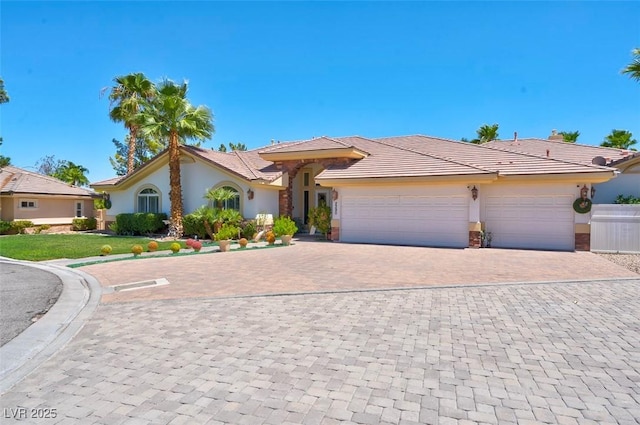 2290 Casa Bella Ct, Las Vegas, NV 89117 - ranch-style home featuring stucco siding, an attached garage, decorative driveway, and a tile roof