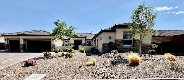 9511 Star Vista Ct, Las Vegas, NV 89149 - view of front of house featuring stone siding, stucco siding, an attached garage, decorative driveway, and a tile roof