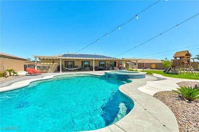 9511 Star Vista Ct, Las Vegas, NV 89149 - view of swimming pool featuring a patio, a pool with connected hot tub, fence, and a playground