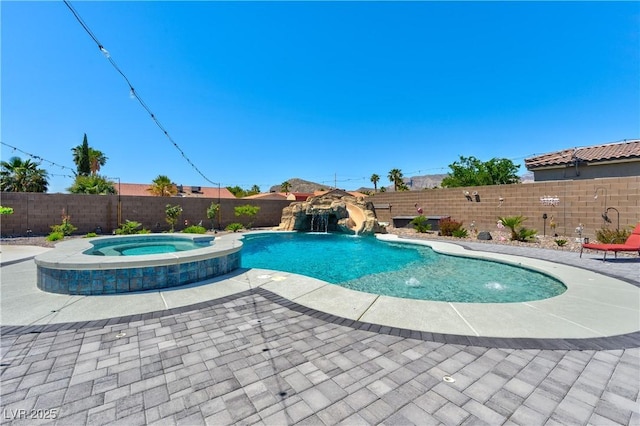 9511 Star Vista Ct, Las Vegas, NV 89149 - view of swimming pool featuring a fenced backyard, a pool with connected hot tub, and a patio area