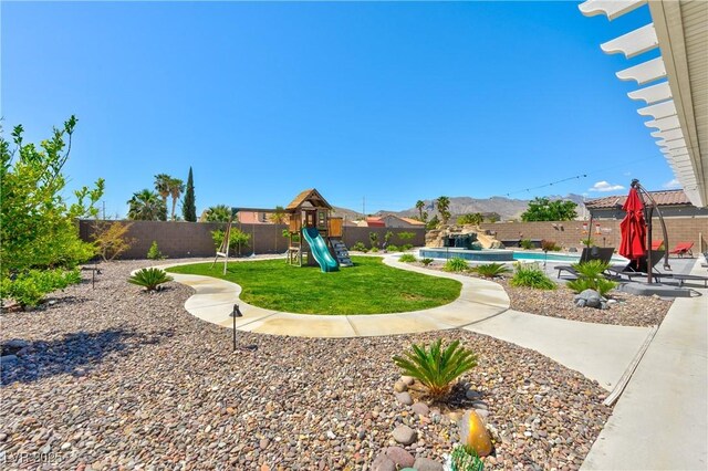 9511 Star Vista Ct, Las Vegas, NV 89149 - view of yard featuring a playground and a mountain view