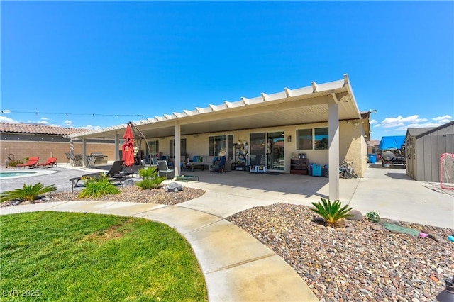 9511 Star Vista Ct, Las Vegas, NV 89149 - rear view of house with a patio, fence, and stucco siding
