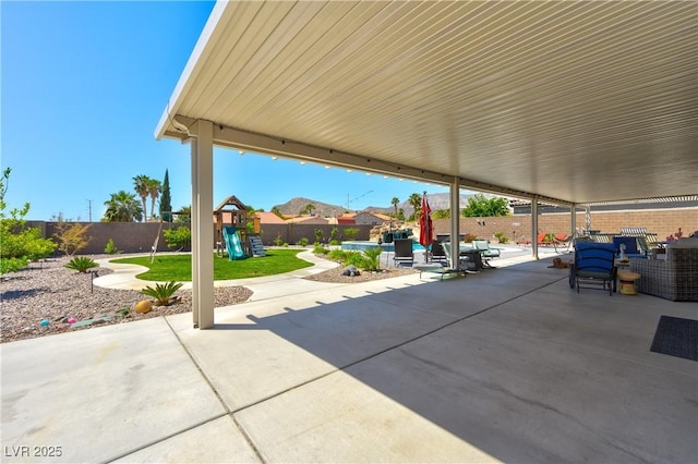 9511 Star Vista Ct, Las Vegas, NV 89149 - view of patio / terrace with a playground, a fenced backyard, and outdoor lounge area