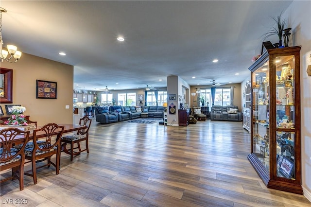 9511 Star Vista Ct, Las Vegas, NV 89149 - dining area featuring ceiling fan, recessed lighting, wood finished floors, and a chandelier