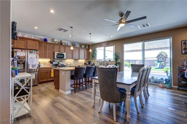 9511 Star Vista Ct, Las Vegas, NV 89149 - dining space featuring a ceiling fan, wood finished floors, recessed lighting, and a textured ceiling