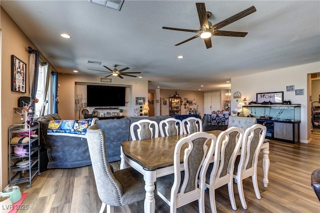 9511 Star Vista Ct, Las Vegas, NV 89149 - dining room with ceiling fan, recessed lighting, and wood finished floors