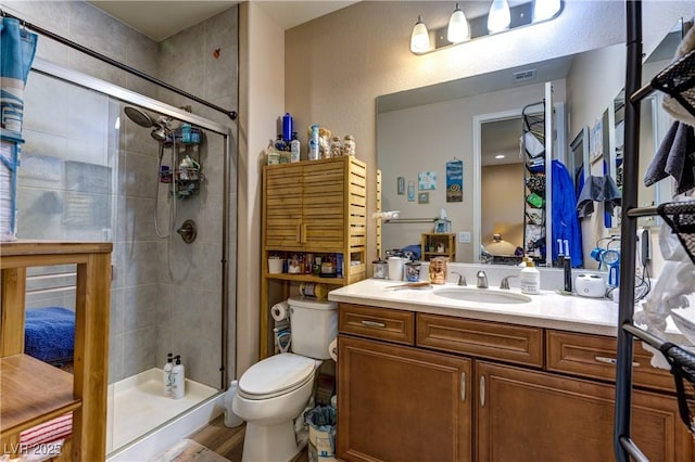 9511 Star Vista Ct, Las Vegas, NV 89149 - bathroom featuring a stall shower, vanity, and toilet