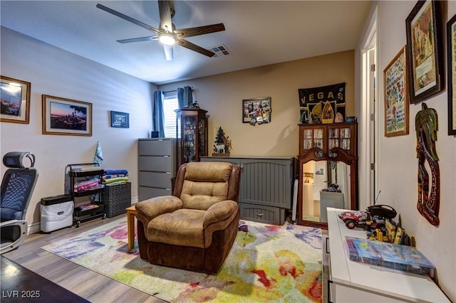 9511 Star Vista Ct, Las Vegas, NV 89149 - living area featuring a ceiling fan and light wood-style floors