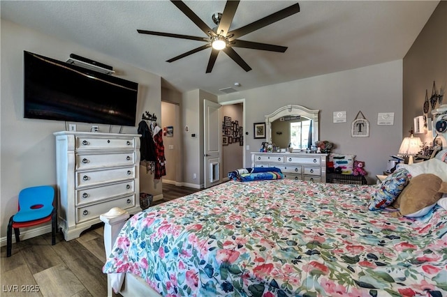 9511 Star Vista Ct, Las Vegas, NV 89149 - bedroom with wood finished floors, baseboards, and ceiling fan