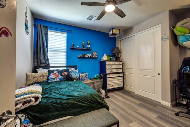 9511 Star Vista Ct, Las Vegas, NV 89149 - bedroom with wood finished floors, a closet, ceiling fan, and baseboards
