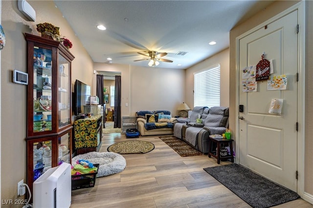 9511 Star Vista Ct, Las Vegas, NV 89149 - living room with wood finished floors, a ceiling fan, and recessed lighting