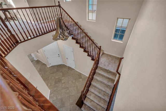 12283 Lost Treasure Ave, Las Vegas, NV 89138 - stairway with baseboards and a high ceiling