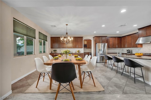 12283 Lost Treasure Ave, Las Vegas, NV 89138 - dining room featuring visible vents, arched walkways, baseboards, a notable chandelier, and recessed lighting