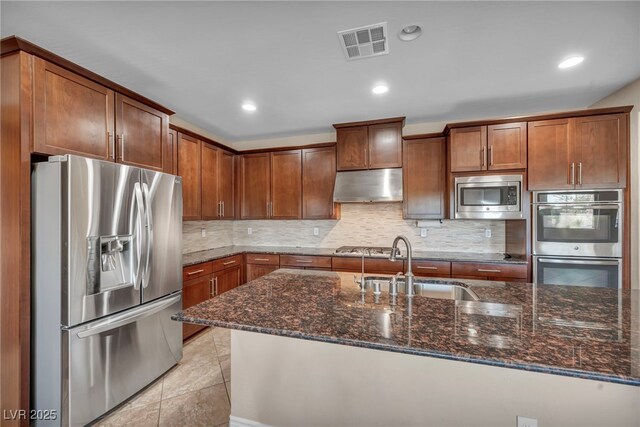 12283 Lost Treasure Ave, Las Vegas, NV 89138 - kitchen featuring backsplash, visible vents, stainless steel appliances, a sink, and under cabinet range hood