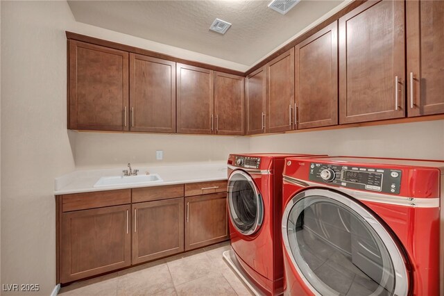 12283 Lost Treasure Ave, Las Vegas, NV 89138 - washroom with a sink, washing machine and dryer, cabinet space, and visible vents