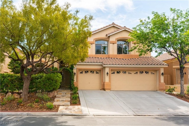 812 Eaglewood Dr, Las Vegas, NV 89144 - mediterranean / spanish-style house with a tile roof, stucco siding, concrete driveway, and a garage
