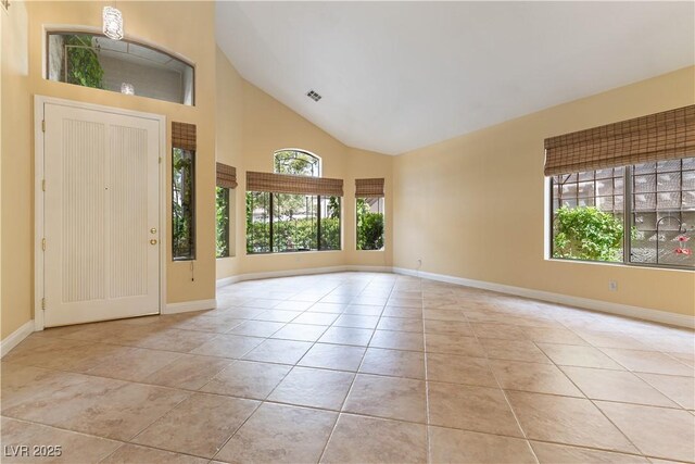 812 Eaglewood Dr, Las Vegas, NV 89144 - entrance foyer featuring high vaulted ceiling and light tile patterned floors