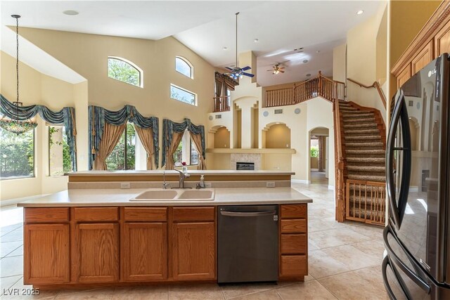 812 Eaglewood Dr, Las Vegas, NV 89144 - kitchen featuring appliances with stainless steel finishes, healthy amount of natural light, a high ceiling, ceiling fan, and arched walkways