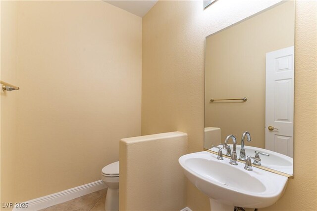 812 Eaglewood Dr, Las Vegas, NV 89144 - half bathroom featuring tile patterned flooring and toilet