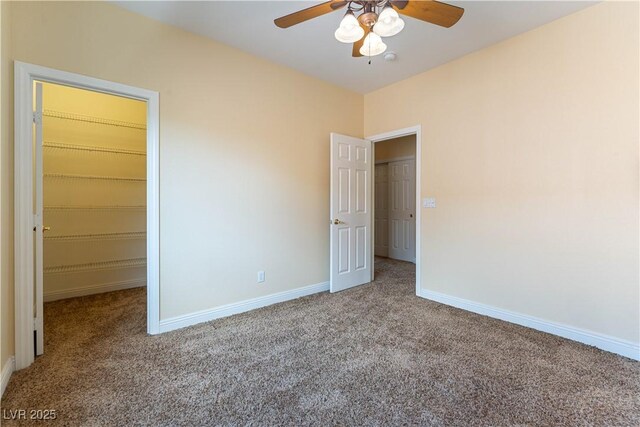 812 Eaglewood Dr, Las Vegas, NV 89144 - unfurnished bedroom with carpet, a spacious closet, ceiling fan, and a closet